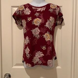 Red top with a flower pattern